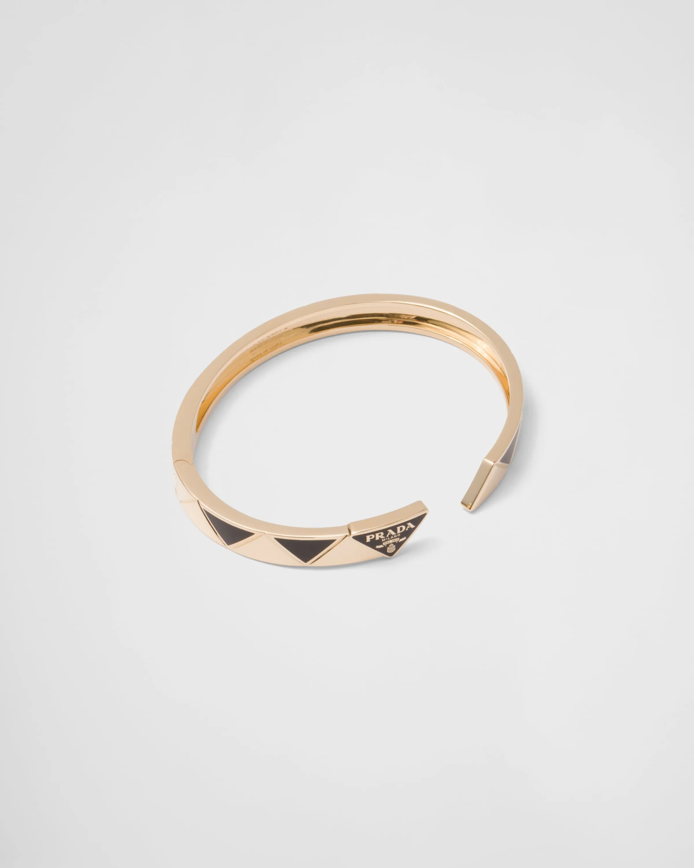 Prada Bracciale rigido Eternal Gold in oro giallo con idroceramica